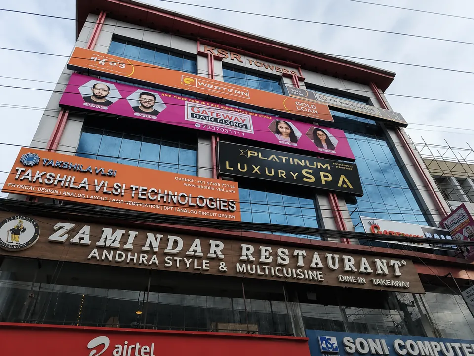 KSR Towers exterior showing the Platinum Luxury Spa board